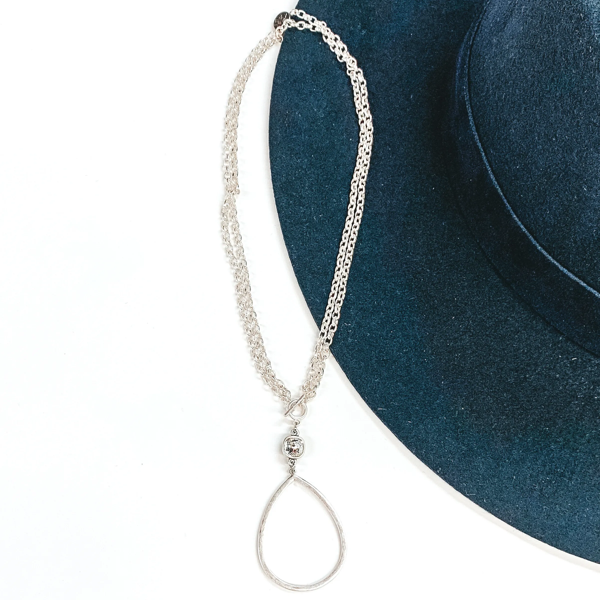 Pink Panache | Silver Open Teardrop Pendant with Clear Cushion Cut Crystal on a Double Silver Chained Necklace with Toggle Front